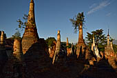 Inle Lake Myanmar. Indein, on the summit of a hill the  Shwe Inn Thein Paya a cluster of hundreds of ancient stupas. Many of them are ruined and overgrown with bushes. 